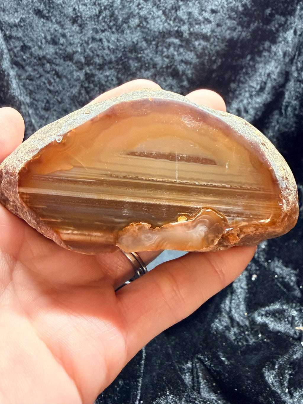 Polished Brazilian water level agate with crystal pocket
