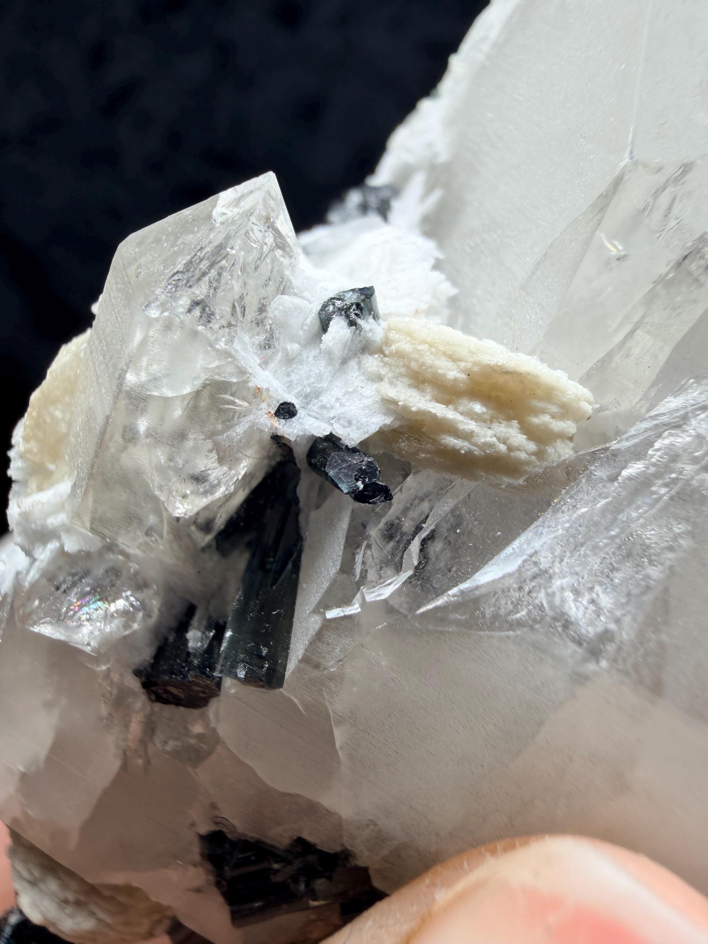 Blue and black tourmaline on quartz with calcite and Muscovite