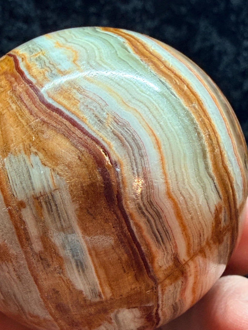 Banded Onyx/calcite egg. UV reactive.