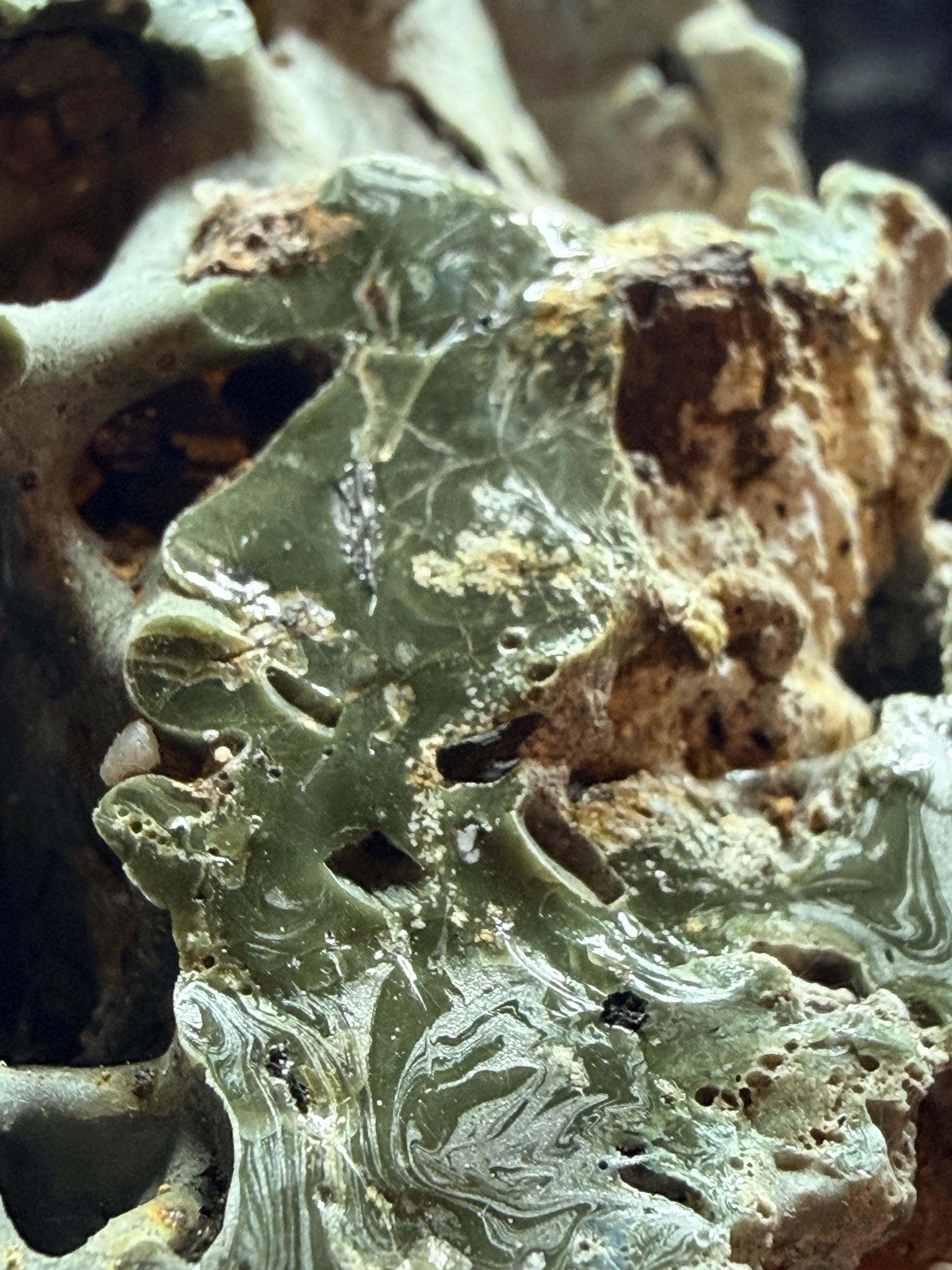 Blue swirl slag glass with coal embedded.