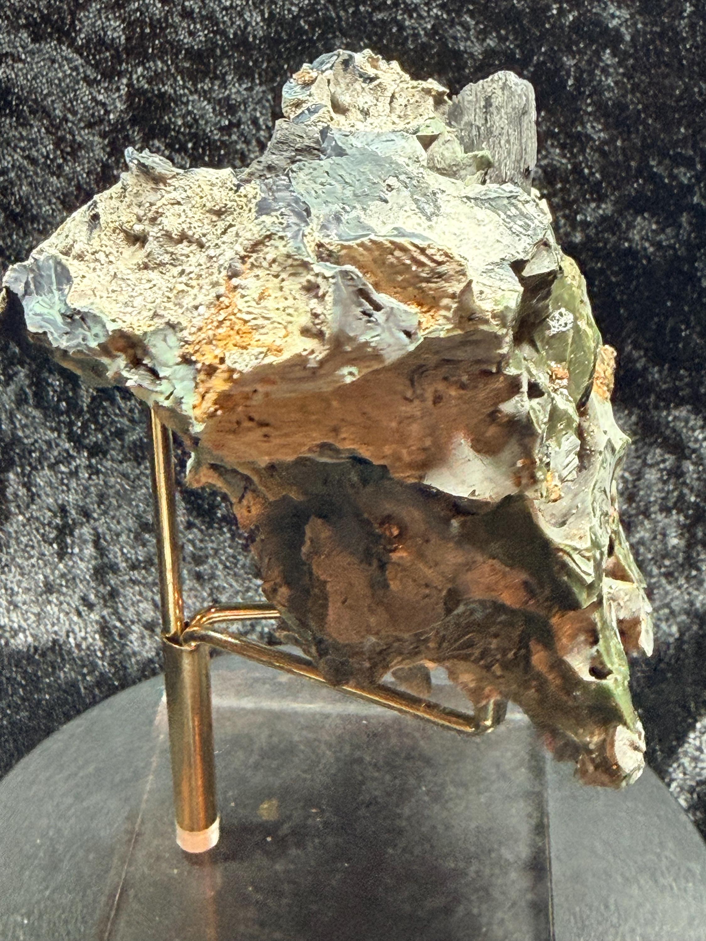 Blue swirl slag glass with coal embedded.