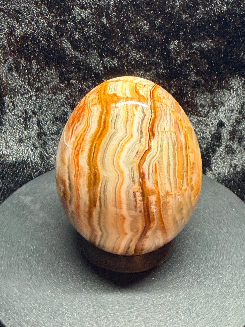 Banded Onyx/calcite egg. UV reactive.