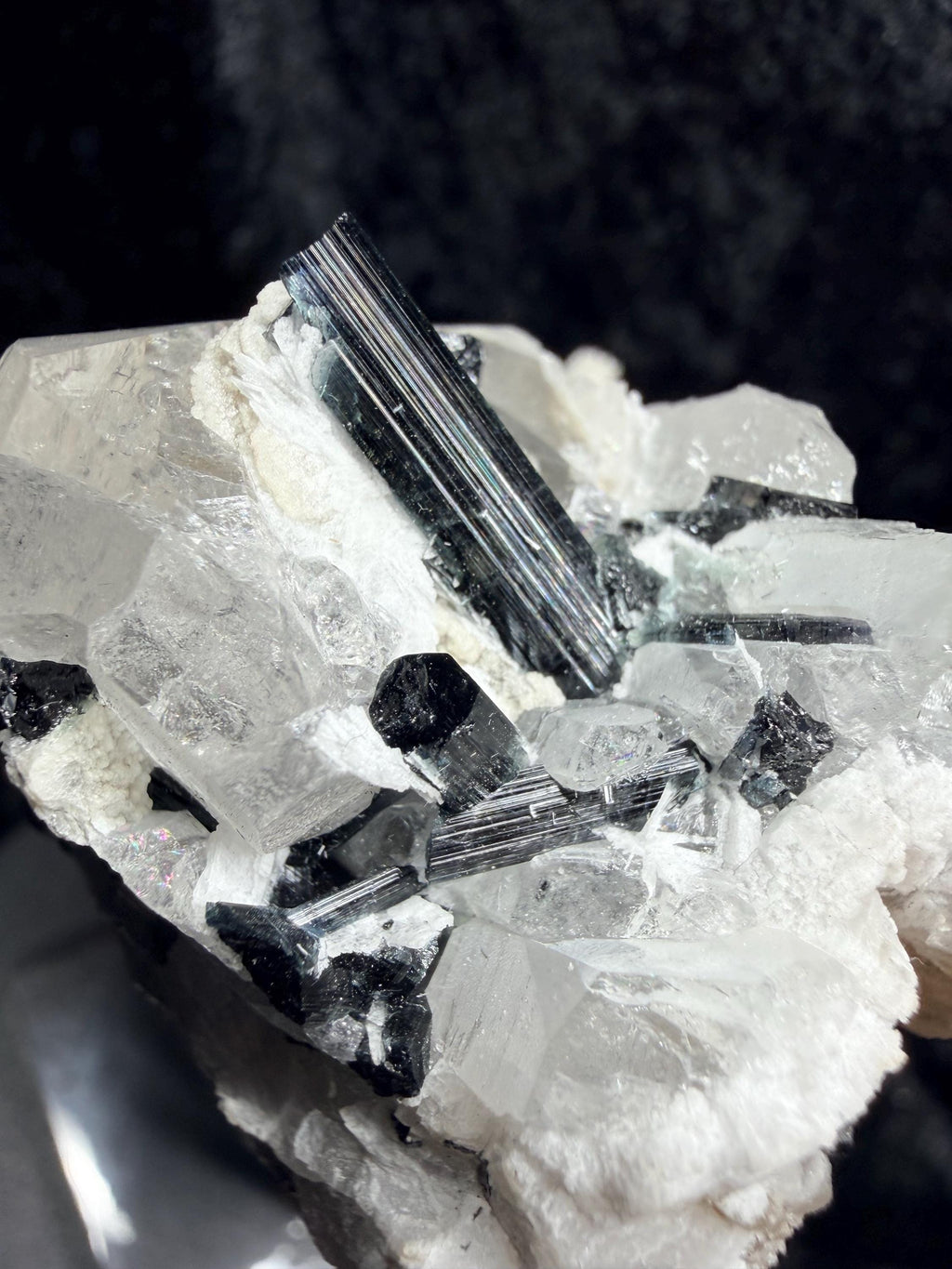 Blue and black tourmaline on quartz with calcite and Muscovite