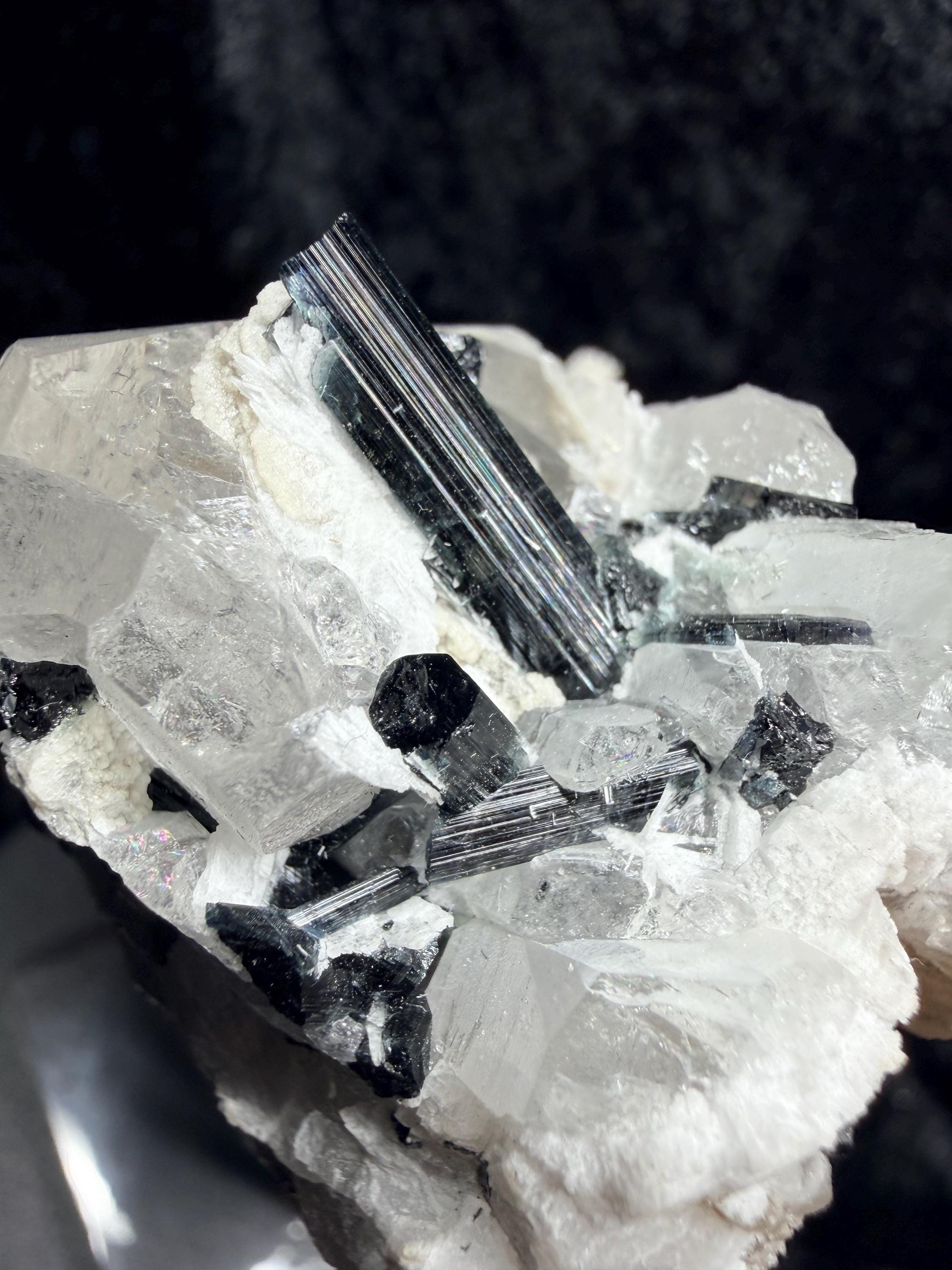Blue and black tourmaline on quartz with calcite and Muscovite