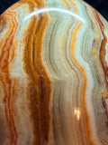 Banded Onyx/calcite egg. UV reactive.