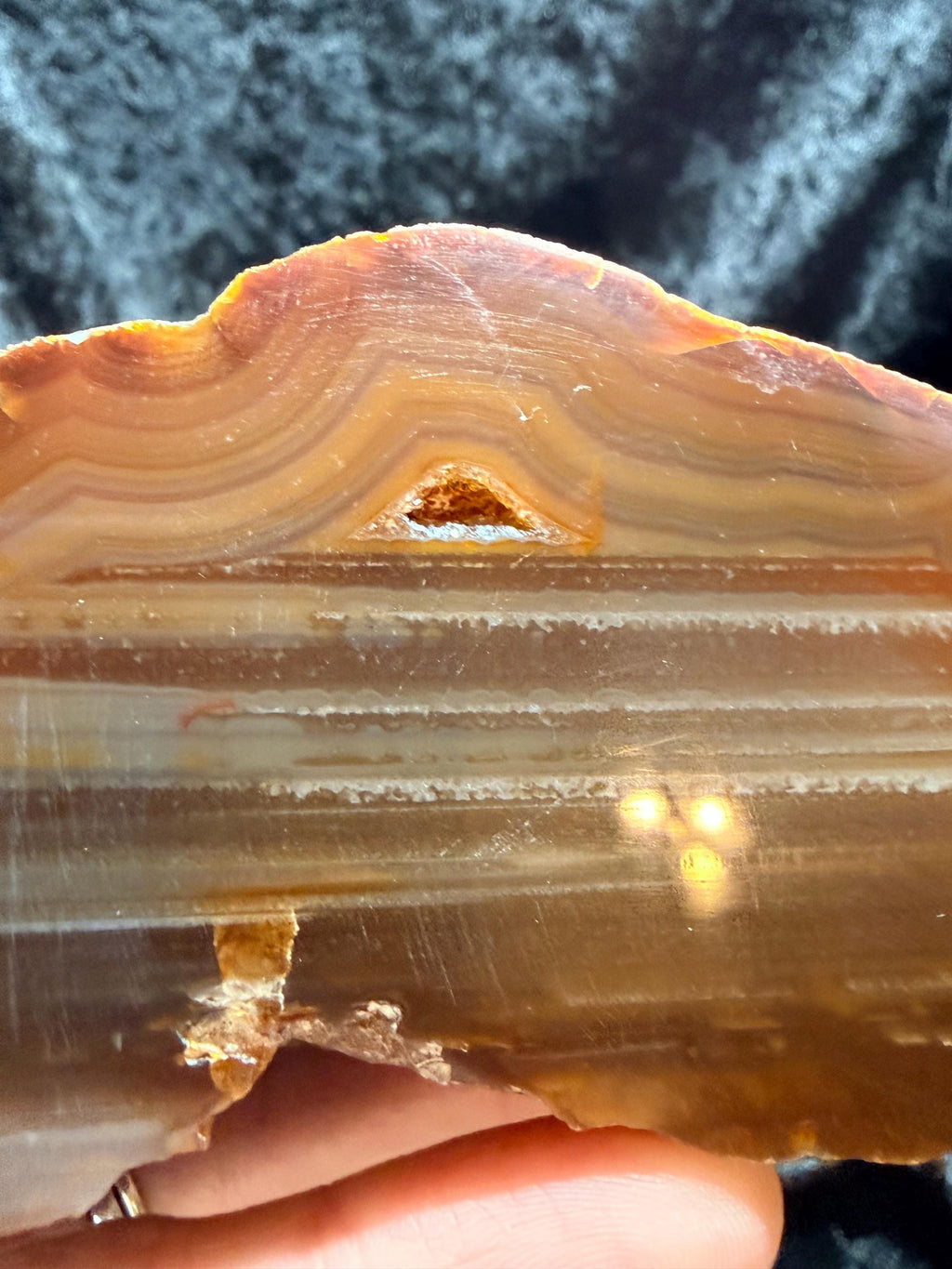 Polished Brazilian water level agate with crystal pocket
