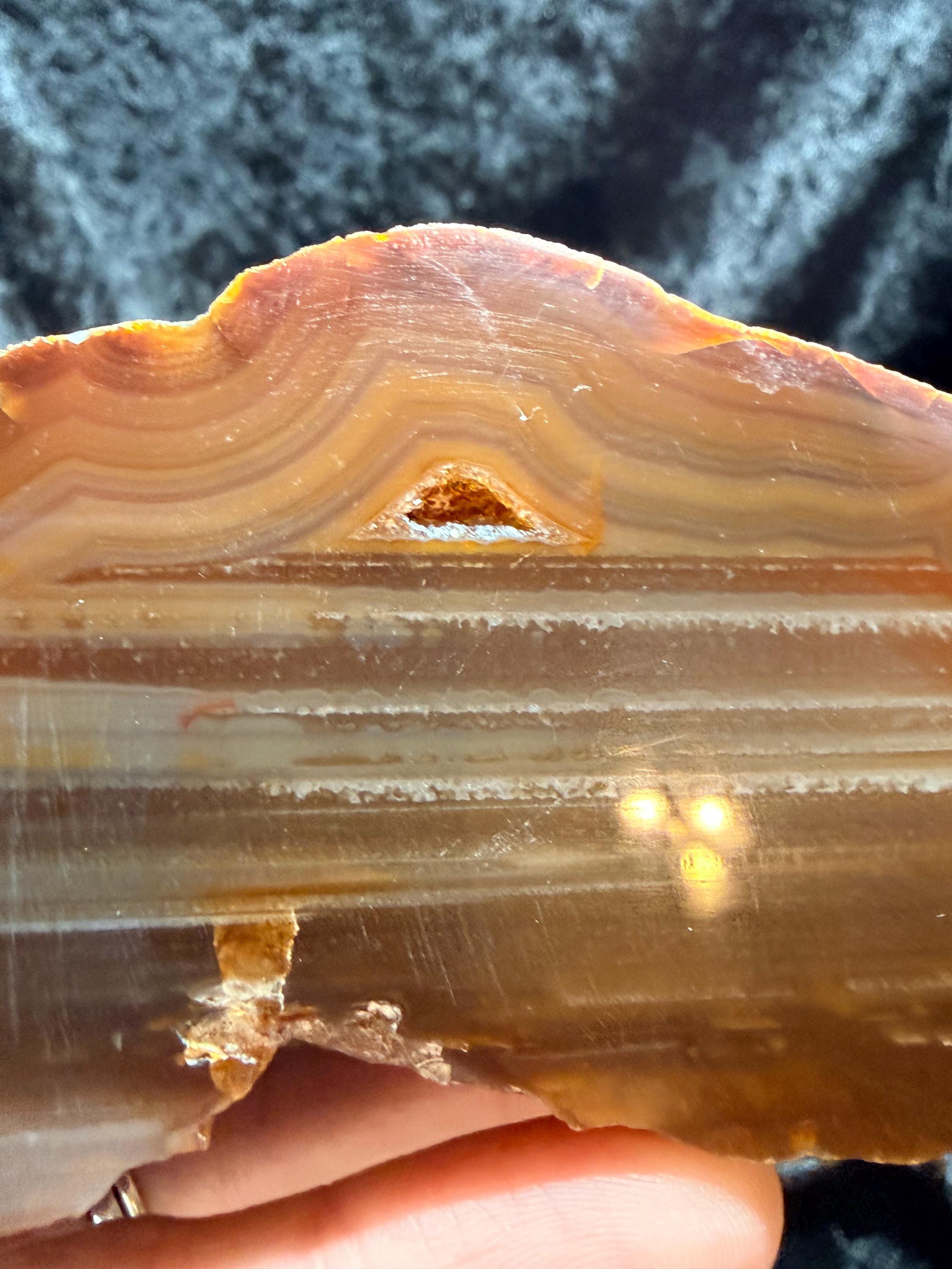 Polished Brazilian water level agate with crystal pocket
