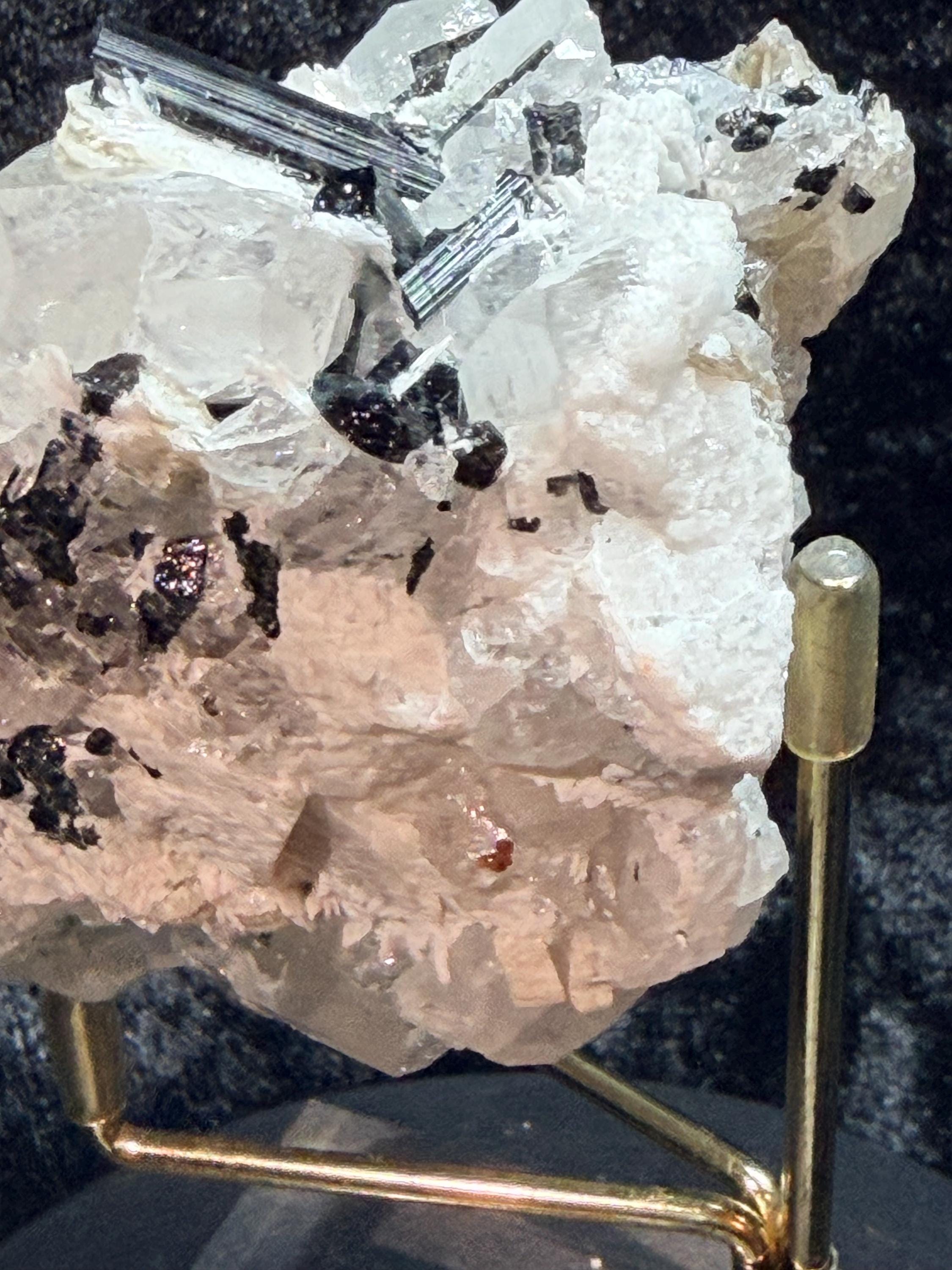 Blue and black tourmaline on quartz with calcite and Muscovite