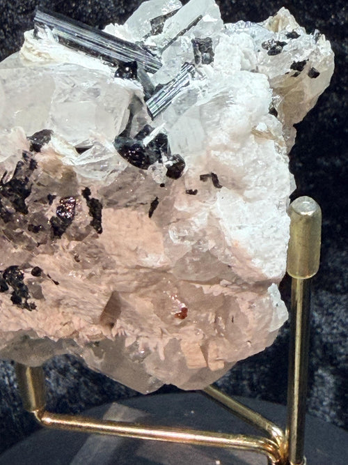 Blue and black tourmaline on quartz with calcite and Muscovite