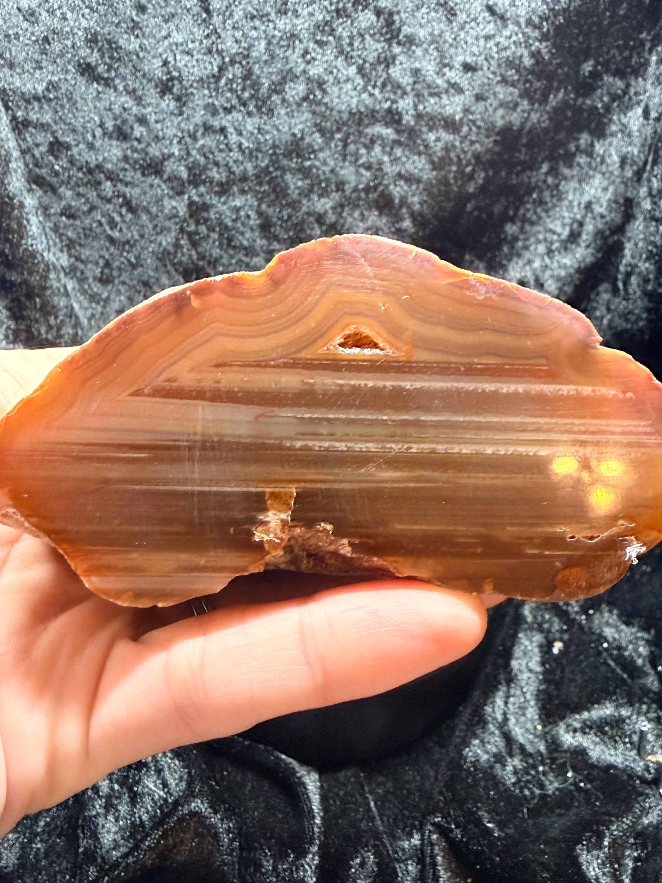 Polished Brazilian water level agate with crystal pocket