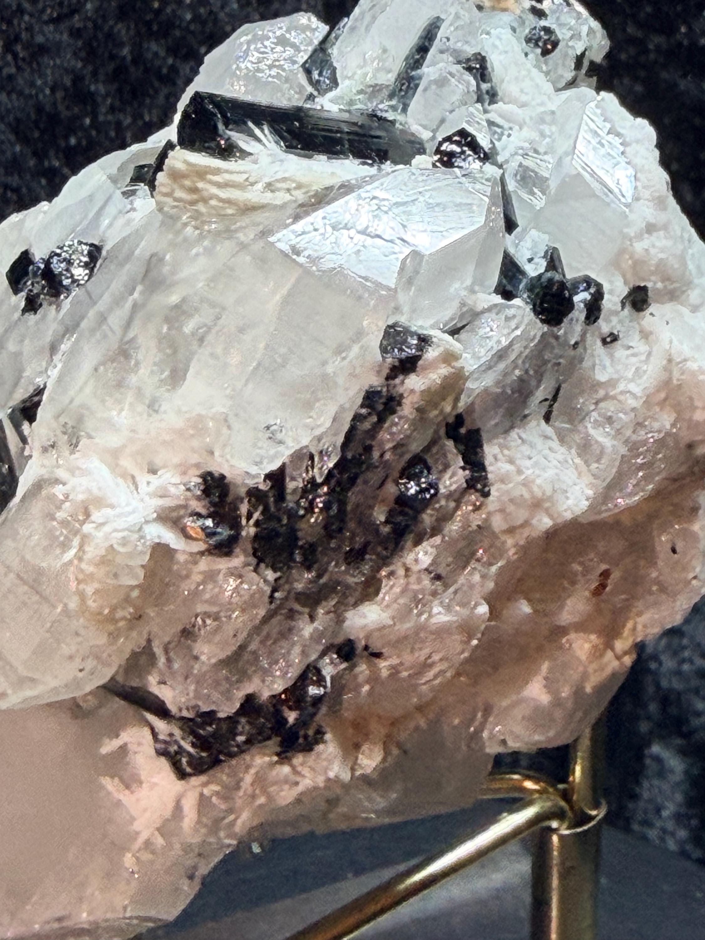 Blue and black tourmaline on quartz with calcite and Muscovite