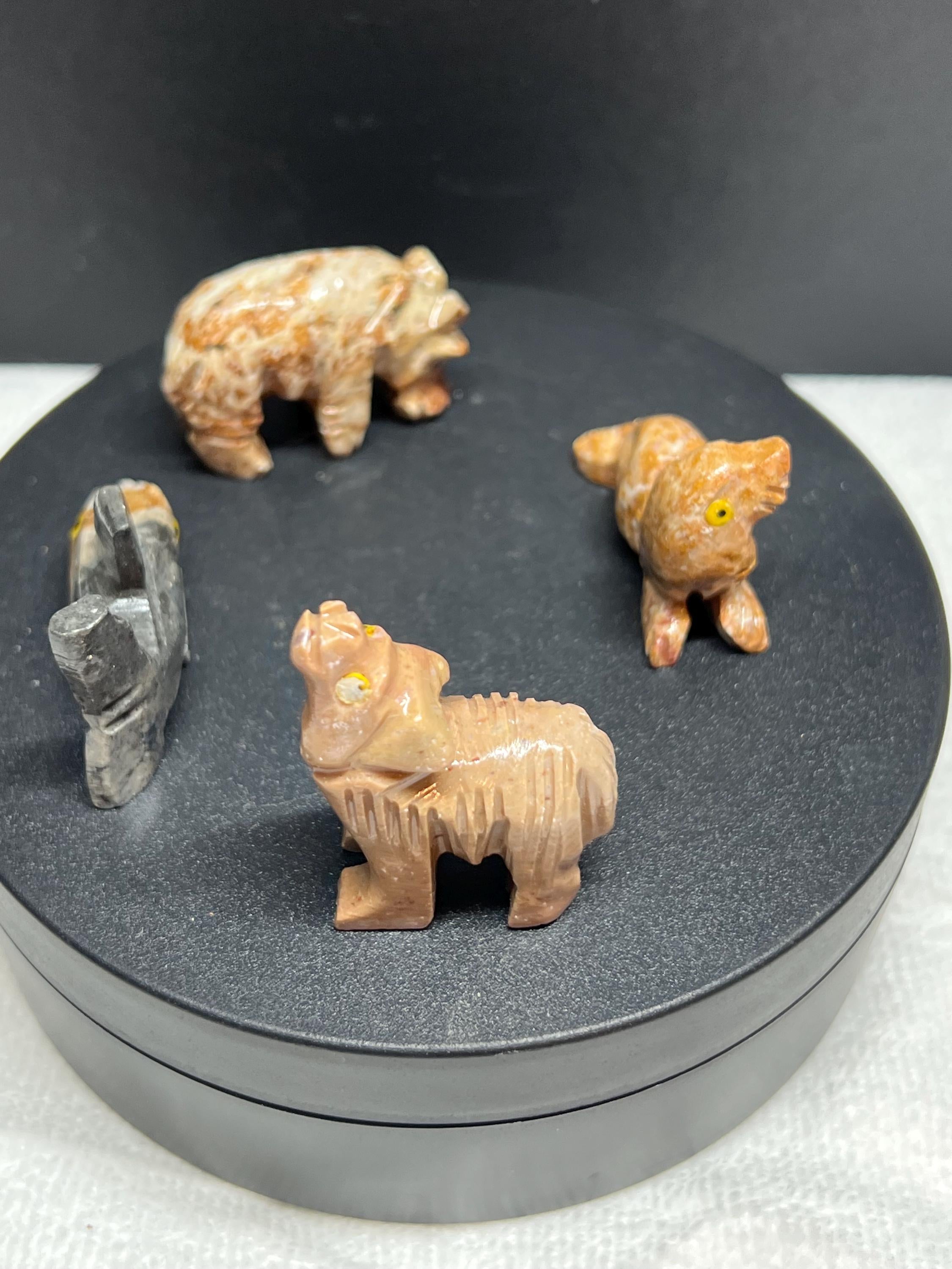 Carved animals, set of 4.