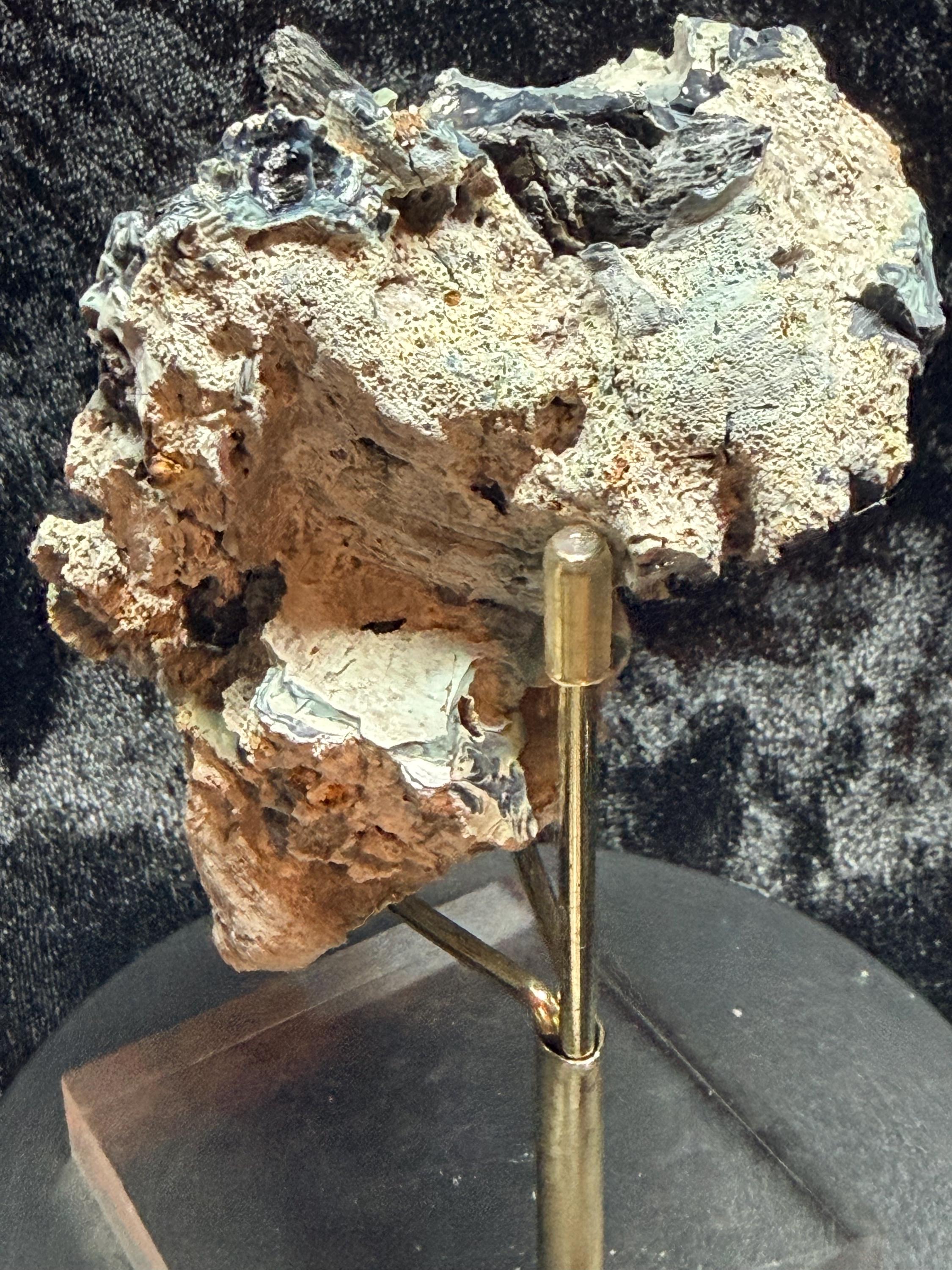 Blue swirl slag glass with coal embedded.