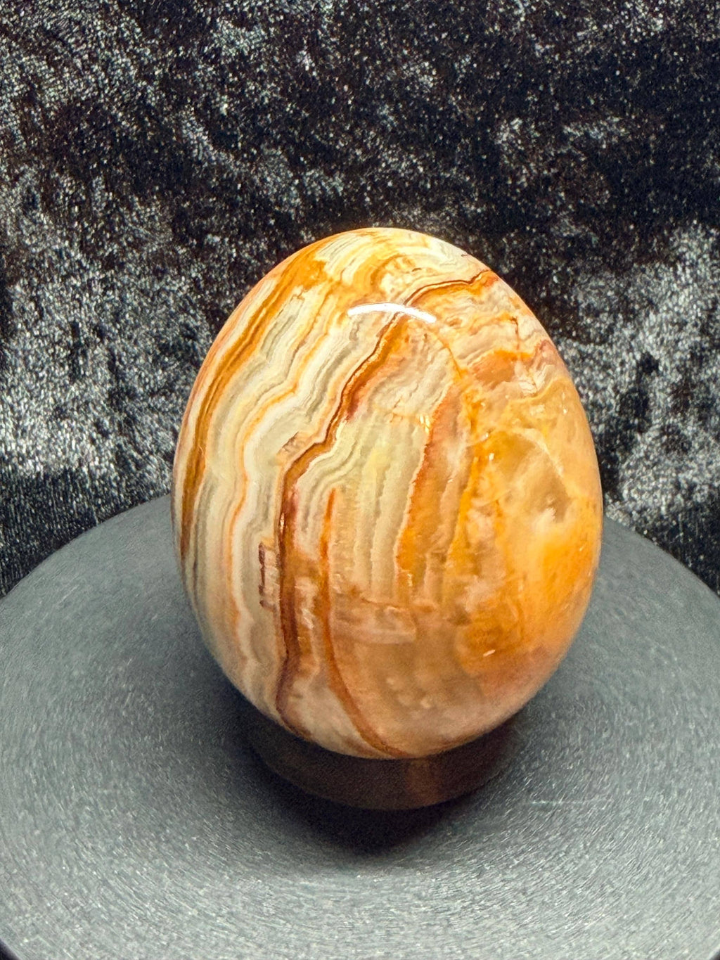 Banded Onyx/calcite egg. UV reactive.