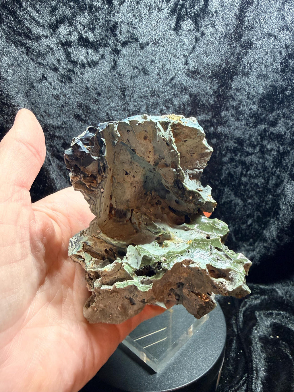Blue swirl slag glass with coal embedded.