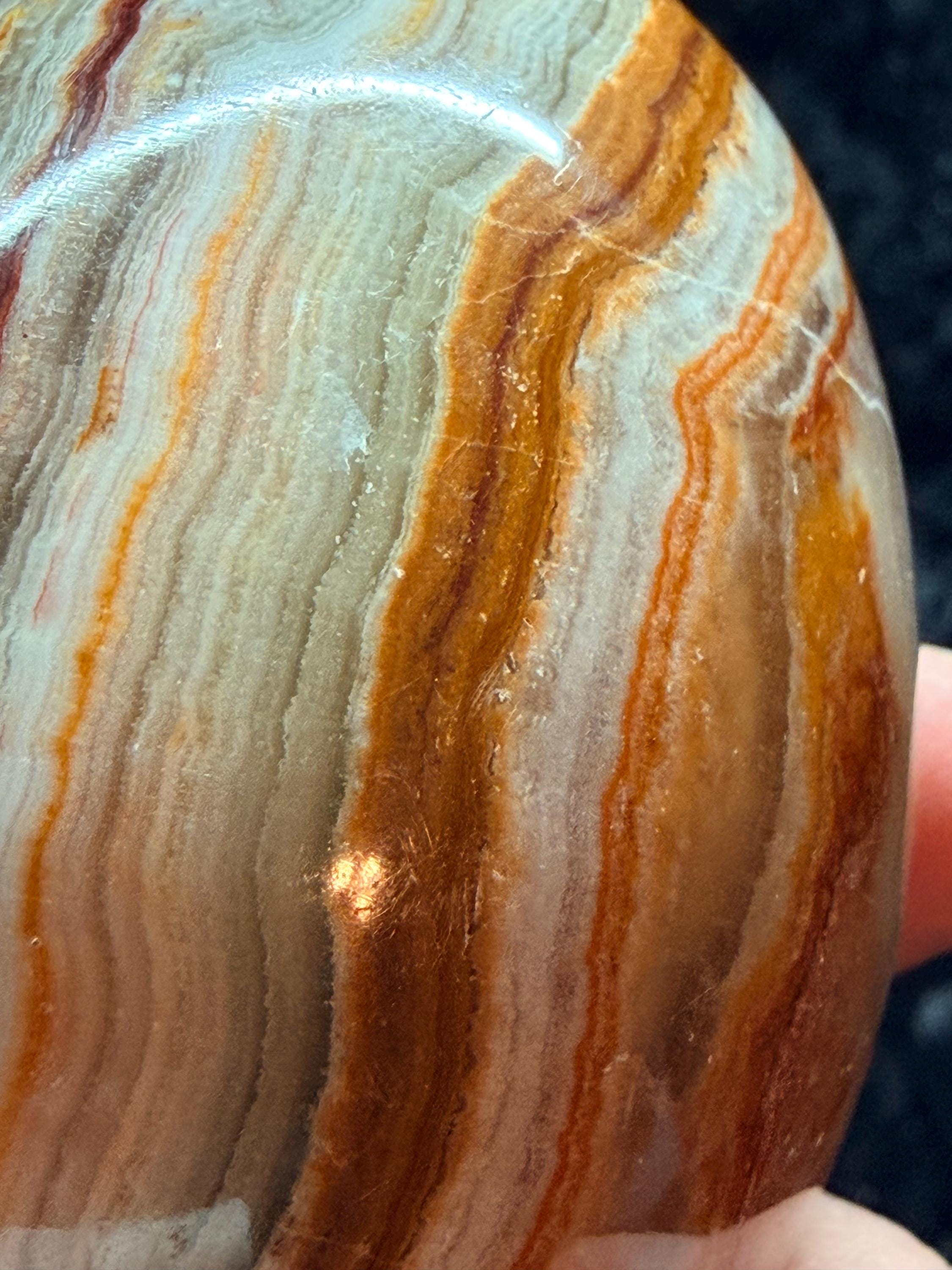 Banded Onyx/calcite egg. UV reactive.