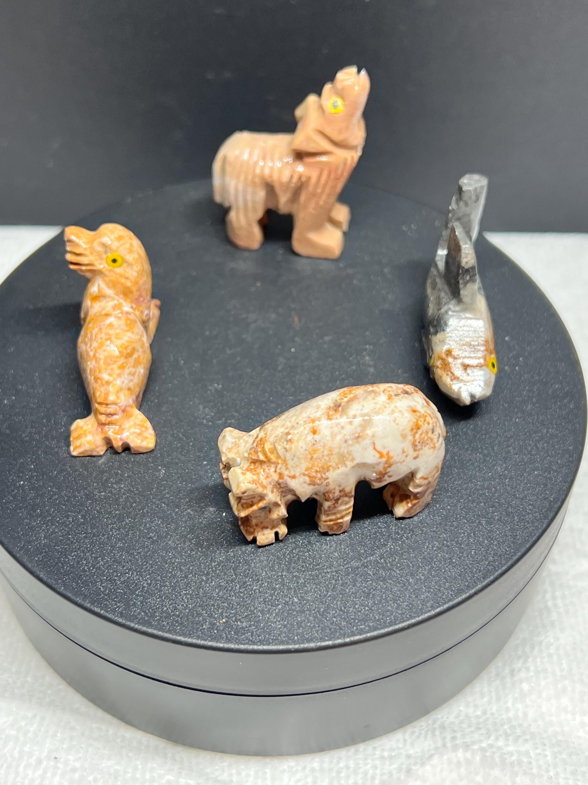 Carved animals, set of 4.